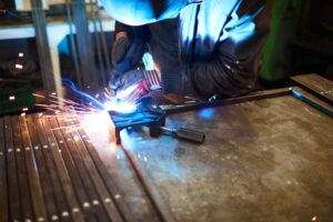 Arc welding in dark workshop