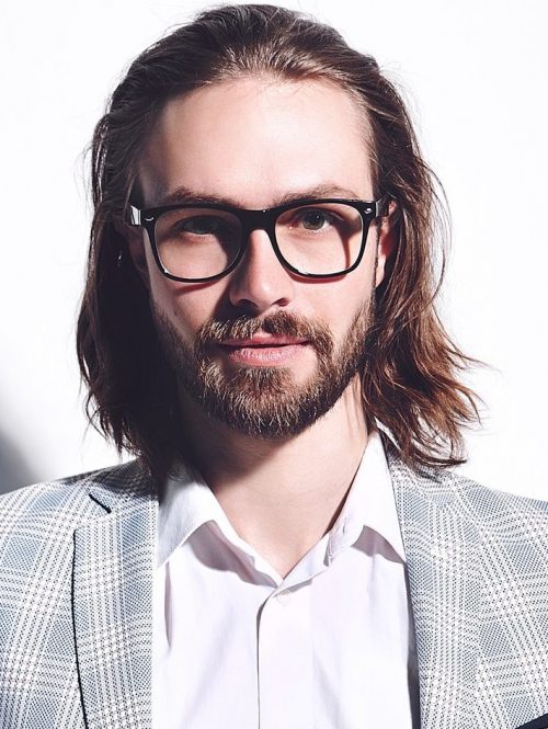 portrait-of-young-handsome-man-posing-in-studio-e1623938925729.jpg